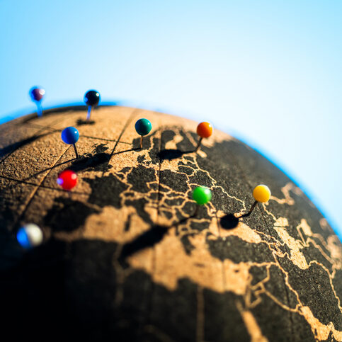 push pins on earth globe